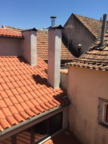 an overhead view of the roofs of two buildings at Casas do Terreiro in Seia