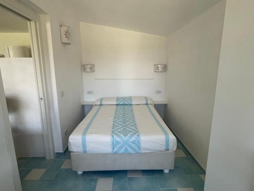 Un pat sau paturi într-o cameră la La casa del giglio