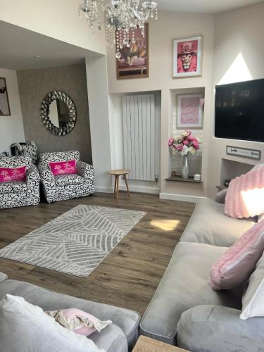 a living room with two couches and a television at Stay Solihull Large spacious home in Solihull close to NEC HS2 Bham Airport in Solihull