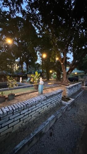 a brick wall in a park at night at Paradise Langkawi in Pulau Tepur
