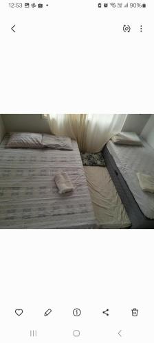 two beds sitting next to each other at Casa Bela Vista in Blumenau