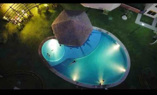 an overhead view of a swimming pool with an island at Casa Sauces Sur, alberca, billar, roof garden privado in Emiliano Zapata