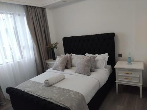 Ένα ή περισσότερα κρεβάτια σε δωμάτιο στο Asali Haven