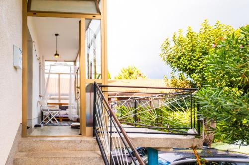 a house with a staircase leading to a balcony at The Loft in Koper