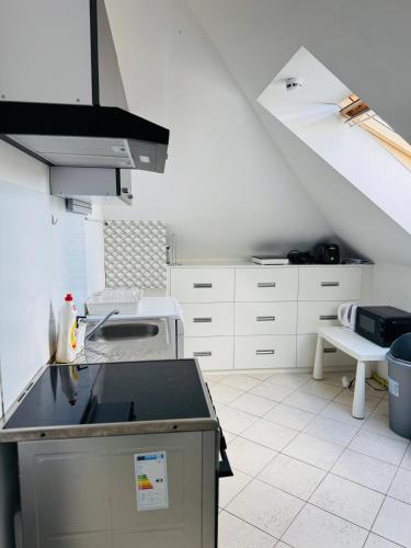a kitchen with a sink and a counter in a room at Entire 2nd floor of Villa with 3bedroom with large garden,BBQ,pool,sauna,free parking in Popovičky