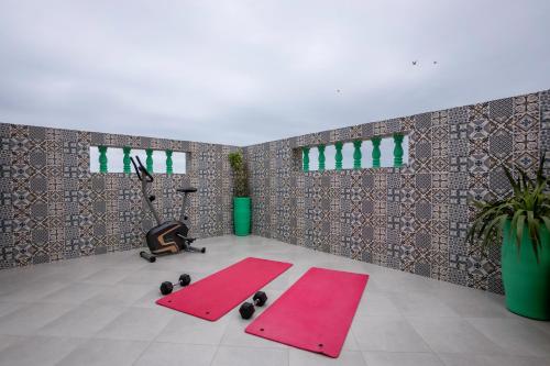 a room with two pink yoga mats on the floor at Dar Diafa Anza in Agadir