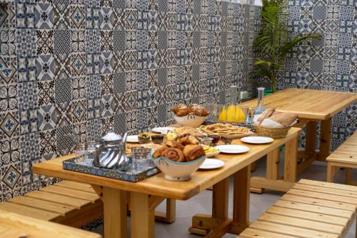 a wooden table with bowls of food on it at Dar Diafa Anza in Agadir