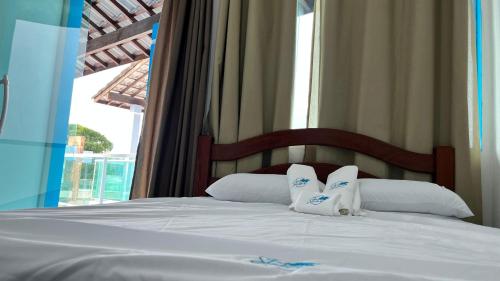 Giường trong phòng chung tại Casa Privativa na Praia dos Carneiros - Cinza