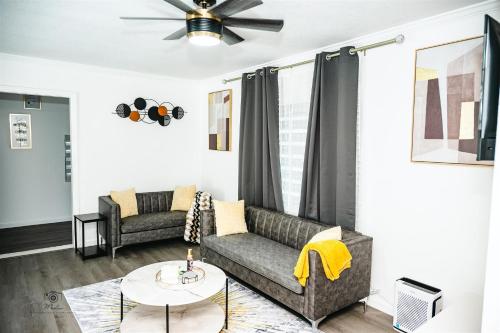 a living room with a couch and a table at Serenity Suite in Jacksonville