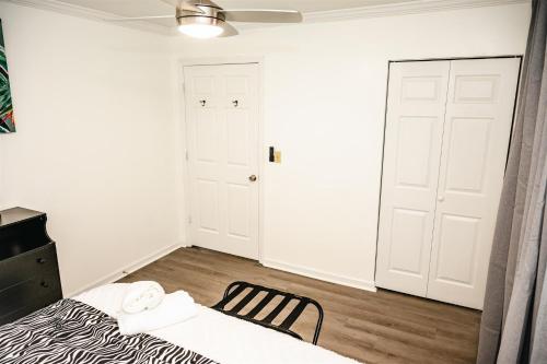 a bedroom with a bed and a ceiling fan at Serenity Suite in Jacksonville