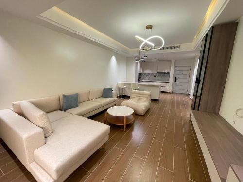 a living room with a couch and a table at Palatial Luxury Hotel and Apartment Juba in Juba