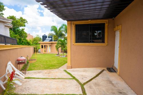 a house with a window on the side of it at Dw apartments with garage and hot tub in Mandeville