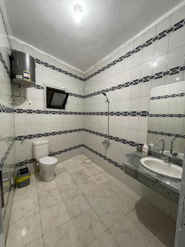 a bathroom with a toilet and a sink at Sun and sea2 in Dahab