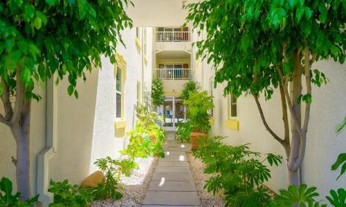 an alley with trees and plants in a building at Motel 6-San Diego, CA - Downtown in San Diego