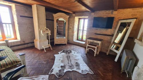 a living room with a table and a mirror at Villa Bellavista in Kavarna