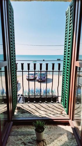 a view of the beach from a window at Villa Bellavista in Kavarna