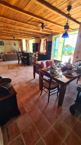 a large living room with a table and chairs at Villa Bellavista in Kavarna