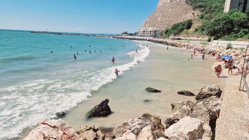 a group of people in the water at a beach at Villa Bellavista in Kavarna