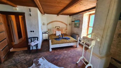 a bedroom with a bed and a table in a room at Villa Bellavista in Kavarna