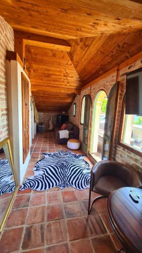 a living room with a zebra rug on the floor at Villa Bellavista in Kavarna