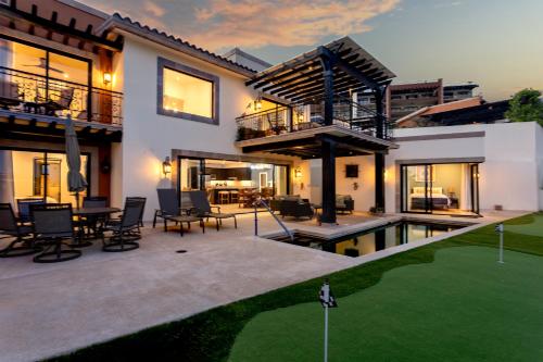 a villa with a pool and a house at Luxe 5 BDRM Copala Villa GOLF Minutes to Marina in Cabo San Lucas
