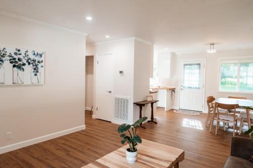 a living room with a couch and a table at Cozy Weekend Retreat in W Knoxville in Knoxville