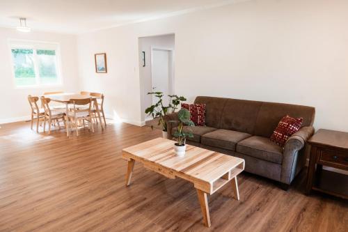 a living room with a couch and a table at Cozy Weekend Retreat in W Knoxville in Knoxville