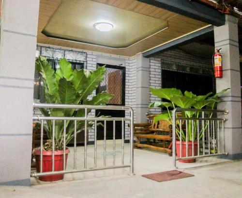 a metal gate in front of a building with plants at 3 BR Spacious and Cozy Bungalow House in Dulongabong
