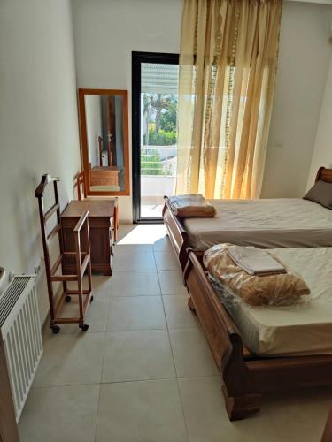 Postel nebo postele na pokoji v ubytování appartement vue mer monastir