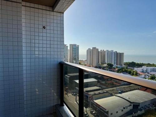 a balcony of a building with a view of a city at (1209)Studio com vista panorâmica mar in São Luís