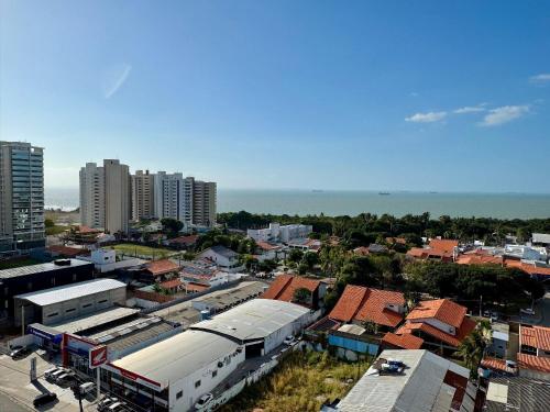 an aerial view of a city with buildings and the ocean at (1209)Studio com vista panorâmica mar in São Luís