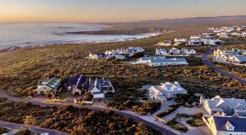 an aerial view of a resort near the ocean at Villa Blau -Stunning Beach Front House Grotto Bay Private Nature Reserve West Coast in Grotto Bay