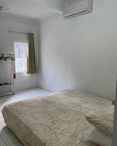 Postel nebo postele na pokoji v ubytování raya house 47