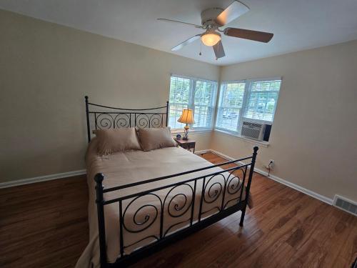 a bedroom with a bed and a ceiling fan at Townhouse at 99 in Boardman