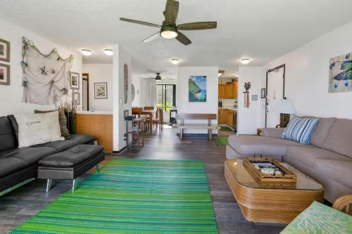 a living room with a couch and a table at Condos in Kapaa in Kapaa
