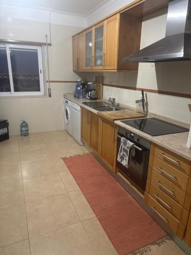 Una cocina o cocineta en Acomodação Particular