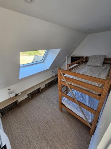 Postel nebo postele na pokoji v ubytování Lodge vue sur mer