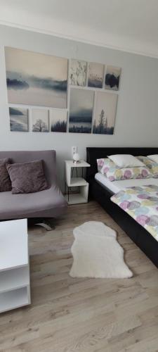 a bedroom with two beds and a white rug at Our Haven in 1220 in Vienna