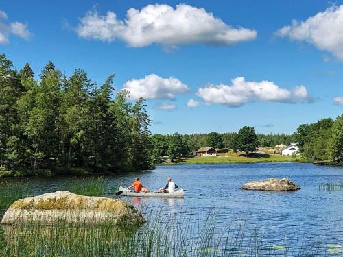 two people in a boat on a lake at 5 person holiday home in Mellösa in Mellösa