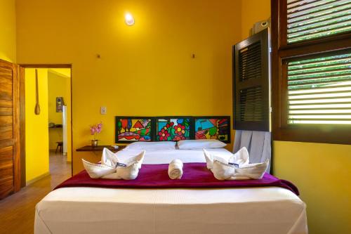 Postel nebo postele na pokoji v ubytování Casa Amarela em Icaraí de Amontada