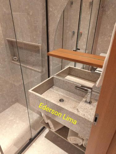a bathroom with a sink and a shower at Salinas Exclusive Resort in Salinópolis