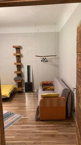 a living room with a couch and a fireplace at Āgenskalns 2 in Riga