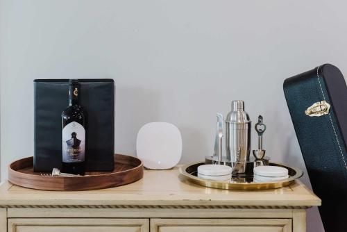 a bottle of wine on top of a table at NordicSauna 3 Ensuite baths TheYellowDoorRetreat in Edmonton