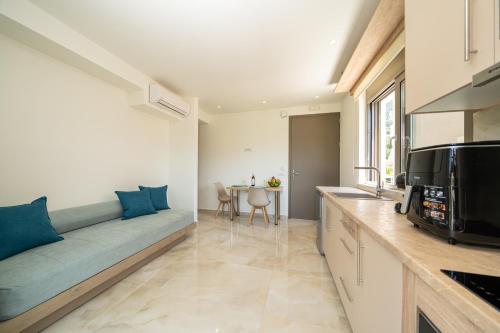 a living room with a couch and a table at Maera Apartments in Sami