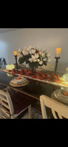a buffet with flowers and food on a table at Boone Trace Inn Room 2 in Pineville