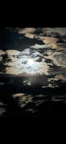 a cloudy sky with the sun poking through at Boone Trace Inn Room 2 in Pineville