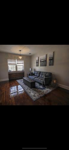 a living room with a couch and a fireplace at Boone Trace Inn Room 2 in Pineville