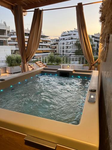 a hot tub on the roof of a building at Athens Top Penthouse With Spa 5' to Metro in Athens