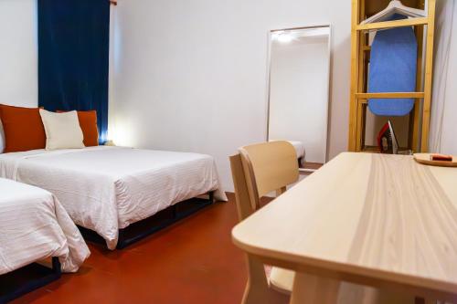 Postel nebo postele na pokoji v ubytování Siento Guelaguetza