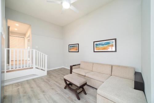 a living room with a couch and a chair at Ocean View Ranch in Hilo